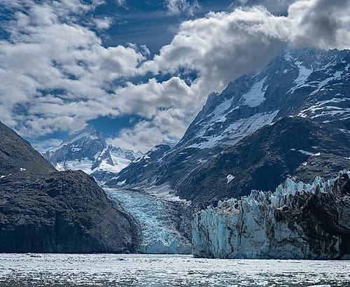 High mountains surrounding Johns Hopkins Inlet generate numerous glaciers. Art Print
